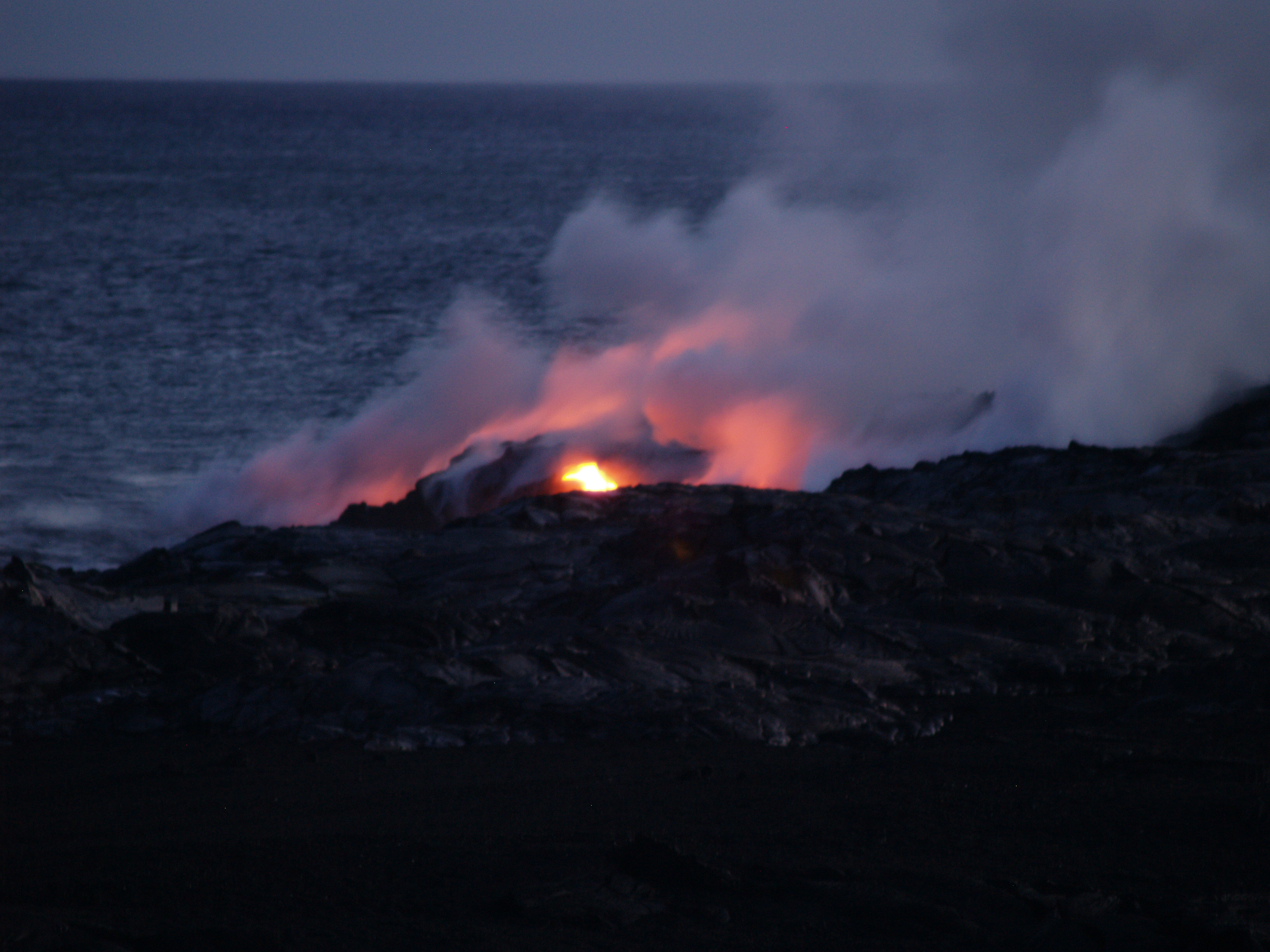 Glowing Lava from Kilauea Volcano Enters the Sea at Waikupanaha on the Big Island of Hawaii: Photograph by Donald B. MacGowan