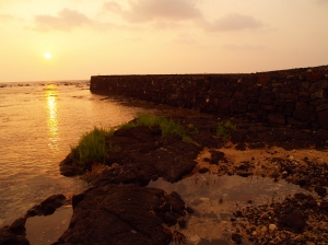Vog Tinged Sunset around Winter Solstice at the Reconstructed Hapaiali'i Heiau: Photo by Donald B. MacGowan