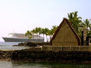 Juxtaposition of Two Cultures; the Newest Queen Mary at Anchor in Kailua Bay, Behind Ancient Ahu'ena Heiau: Photo by Donald B. MacGowan