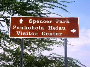 Even at Highway Speeds, The English on This Sign IS Easy To Read, Whereas The Visitor May Have Trouble Decoding The Hawaiian Language Words Quickly Quickly Enough to Turn: Photo By Japhy Ryder