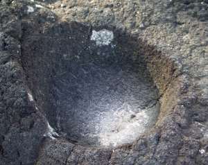 Small Bowl Carved into Surface of Basalt, Pu'u Honua O Honaunau National Historic Park, Hawaii: Photo by Donnie MacGowan