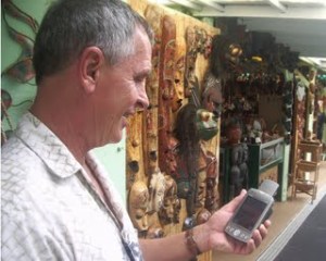 Frank Burgess uses the Tour Guide App to explore shopping possibilities around Kailua Kona.jpg