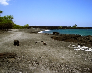 The road south from Kiholo Bay dead ends at an elaborate mansion; from there a trail can be taken around the headland to a remarkable black sand cove that provide gorgeous, if exposed, snorkeling: Photo by Donald B. MacGowan