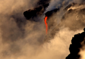 Lava from Kilauea Volcano flows into the ocean near Kalapana, Hawaii: Photograph by Donald B. MacGowan