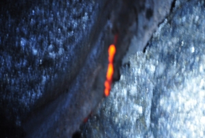 The same dim lava in the dark: note the glow indicating the presence of dangerous, liquid lava mere inches below the ground surface: Photo by Donald B MacGowan