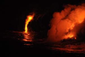 A Lava Ribbon Flows Into the Ocean, Near Kalapana, Hawaii: Photo by Donnie MacGowan